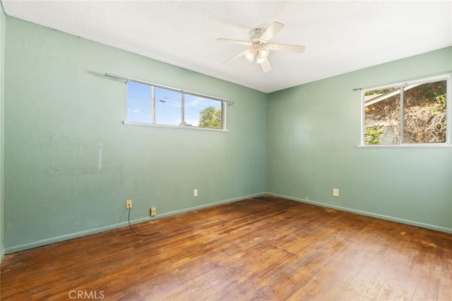 2631 San Jose St, Chico, CA 95973 - empty room with wood-type flooring, a ceiling fan, and baseboards