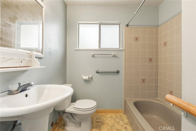 2631 San Jose St, Chico, CA 95973 - bathroom with toilet, bathing tub / shower combination, a sink, tile patterned flooring, and baseboards