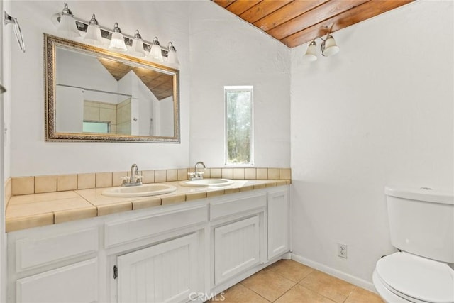2631 San Jose St, Chico, CA 95973 - full bath featuring lofted ceiling, toilet, double vanity, tile patterned flooring, and wooden ceiling