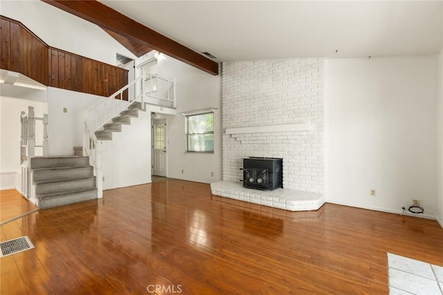 2631 San Jose St, Chico, CA 95973 - unfurnished living room with stairway, wood finished floors, and a wood stove