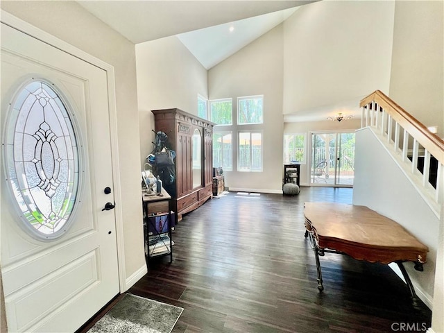 29403 Clear View Ln, Highland, CA 92346 - foyer with dark wood-type flooring, stairs, baseboards, and high vaulted ceiling