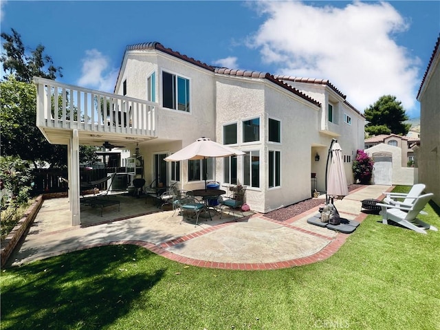 29403 Clear View Ln, Highland, CA 92346 - back of house with a balcony, a tile roof, stucco siding, and ceiling fan
