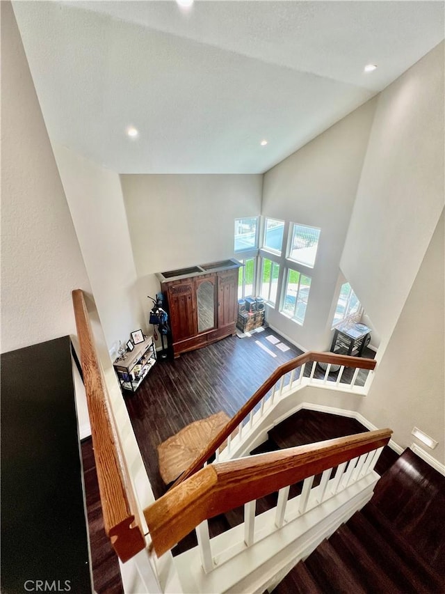 29403 Clear View Ln, Highland, CA 92346 - stairs with wood finished floors, recessed lighting, baseboards, and high vaulted ceiling