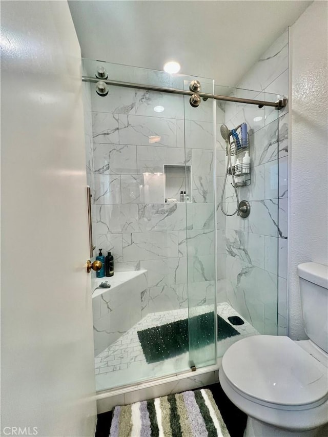 29403 Clear View Ln, Highland, CA 92346 - full bathroom featuring toilet and a marble finish shower