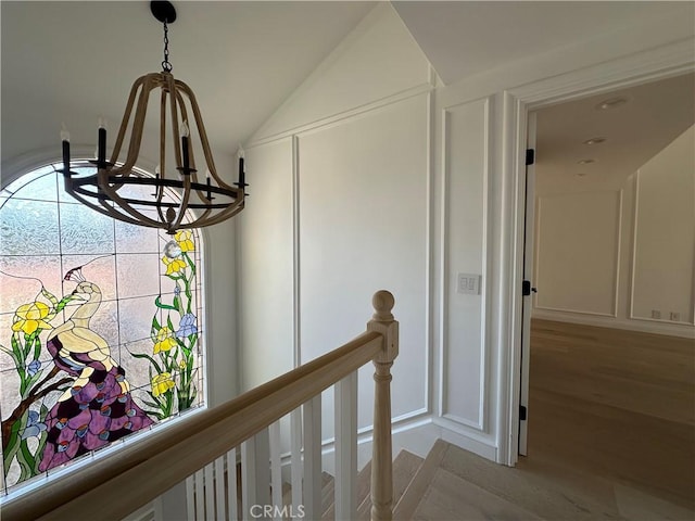 23128 Park Sorrento, Calabasas, CA 91302 - detailed view of a decorative wall, a chandelier, and wood finished floors