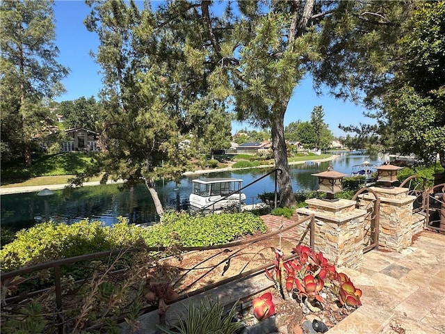 23128 Park Sorrento, Calabasas, CA 91302 - view of patio / terrace with a water view