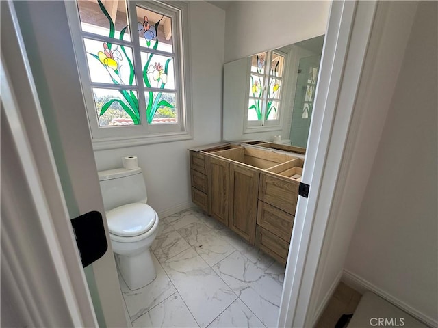 23128 Park Sorrento, Calabasas, CA 91302 - bathroom featuring marble finish floors, toilet, vanity, and baseboards
