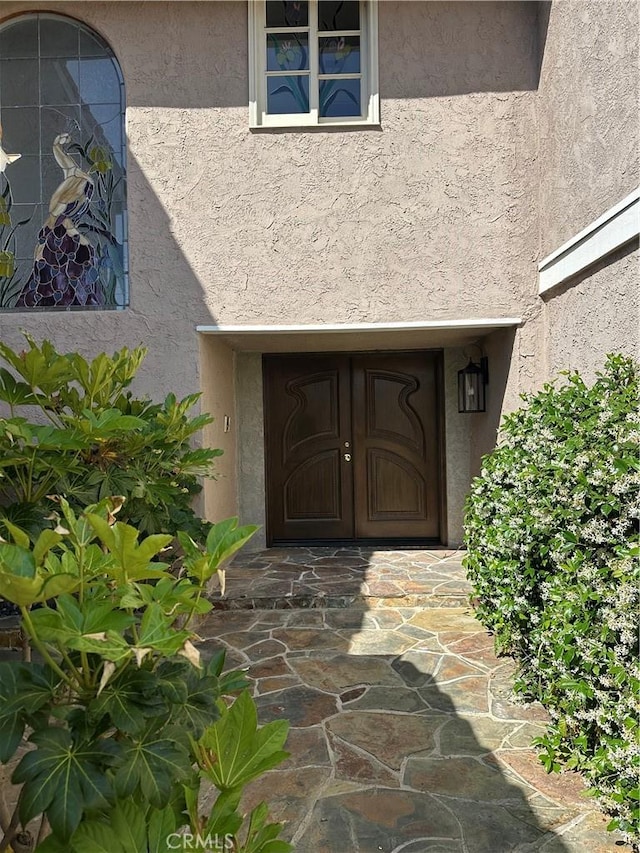 23128 Park Sorrento, Calabasas, CA 91302 - doorway to property featuring stucco siding