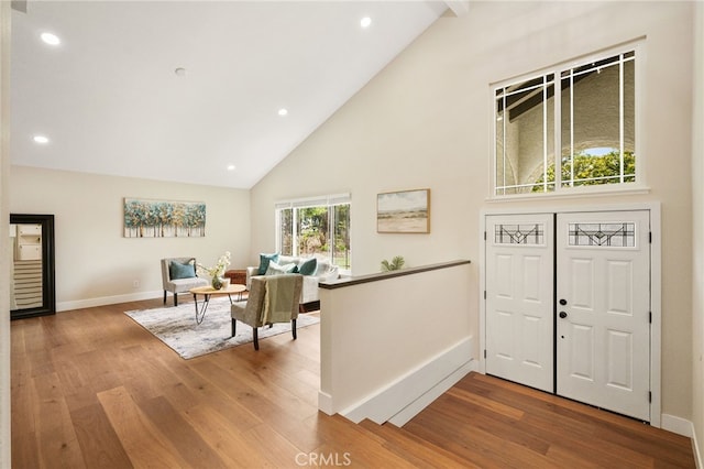 1917 N Quince Way, Upland, CA 91784 - entryway featuring high vaulted ceiling, wood finished floors, baseboards, and recessed lighting