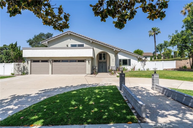 1917 N Quince Way, Upland, CA 91784 - view of front of property featuring stucco siding, an attached garage, and driveway