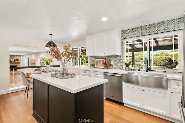 1917 N Quince Way, Upland, CA 91784 - kitchen with stainless steel dishwasher, a sink, light countertops, light wood finished floors, and recessed lighting