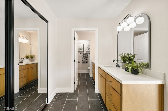 1917 N Quince Way, Upland, CA 91784 - full bathroom with vanity, toilet, tile patterned floors, and baseboards