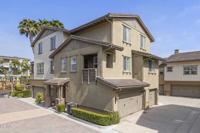1524 Windshore Way, Oxnard, CA 93035 - view of property with an attached garage, driveway, and stucco siding