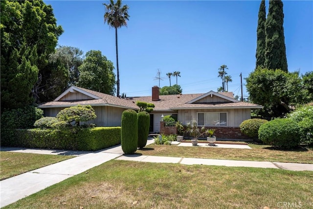 11829 Balboa Blvd, Granada Hills, CA 91344 - single story home featuring a front yard, a chimney, and brick siding