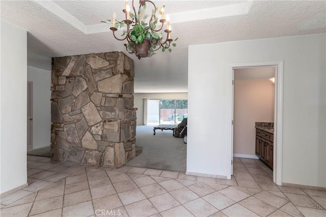 11829 Balboa Blvd, Granada Hills, CA 91344 - corridor featuring a textured ceiling, a chandelier, and light tile patterned floors