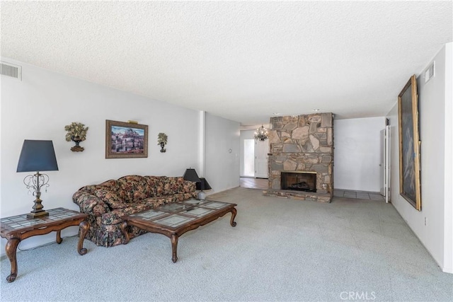 11829 Balboa Blvd, Granada Hills, CA 91344 - living room with carpet flooring, a textured ceiling, and a stone fireplace