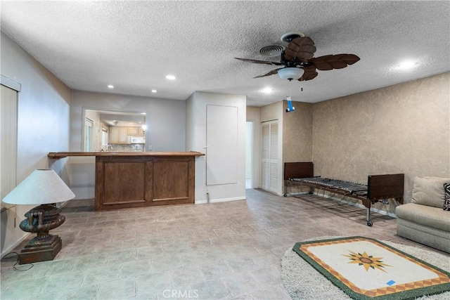 11829 Balboa Blvd, Granada Hills, CA 91344 - living area featuring a ceiling fan, a textured ceiling, recessed lighting, and baseboards