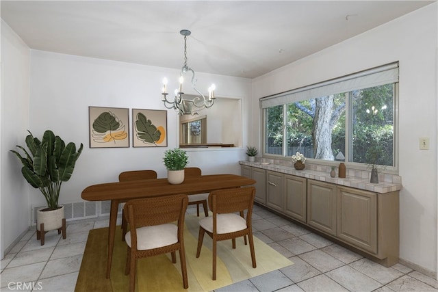 11829 Balboa Blvd, Granada Hills, CA 91344 - dining room with a chandelier and light tile patterned floors