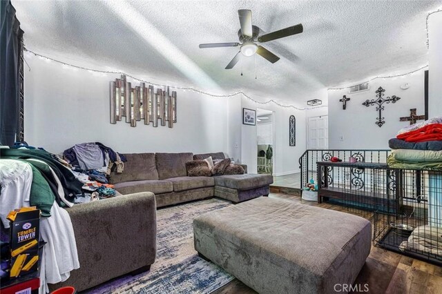 2192 Beverly Ave, Clovis, CA 93611 - living area with a textured ceiling, a ceiling fan, and wood finished floors
