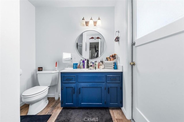 2192 Beverly Ave, Clovis, CA 93611 - bathroom with wood finished floors, vanity, and toilet