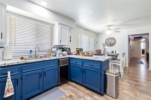 2192 Beverly Ave, Clovis, CA 93611 - kitchen with blue cabinetry, a peninsula, and plenty of natural light