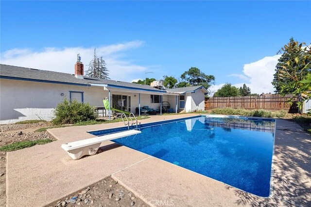 2192 Beverly Ave, Clovis, CA 93611 - view of swimming pool with a patio area and a diving board