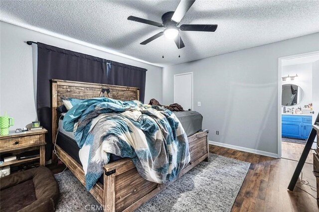 2192 Beverly Ave, Clovis, CA 93611 - bedroom with a textured ceiling, wood finished floors, connected bathroom, baseboards, and a ceiling fan