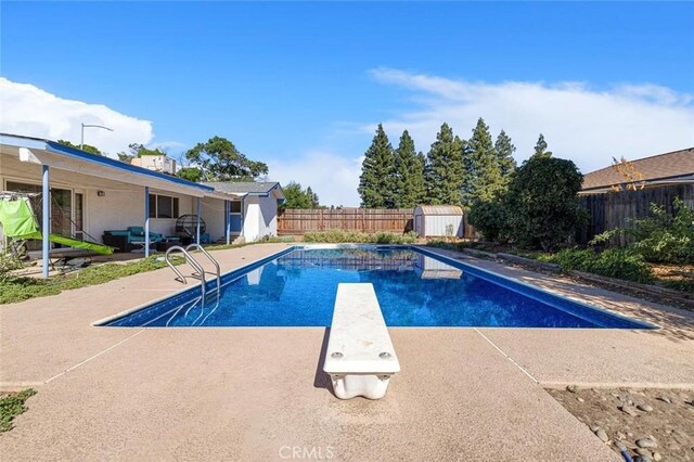 2192 Beverly Ave, Clovis, CA 93611 - view of pool featuring a fenced backyard, a patio, and a diving board