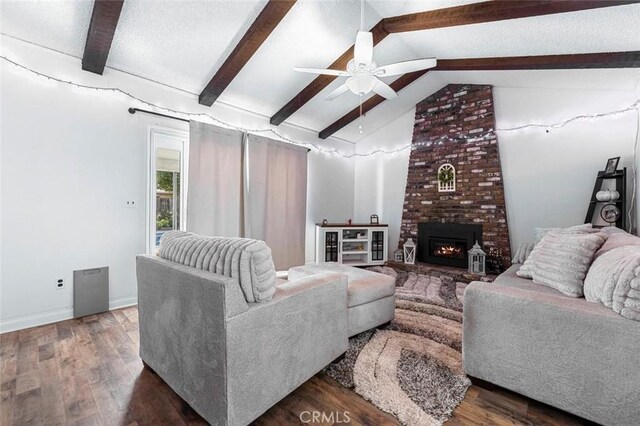 2192 Beverly Ave, Clovis, CA 93611 - living area with ceiling fan, wood finished floors, a brick fireplace, and baseboards