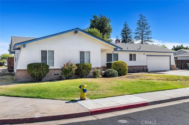 2192 Beverly Ave, Clovis, CA 93611 - ranch-style home with stucco siding, an attached garage, concrete driveway, a front lawn, and brick siding