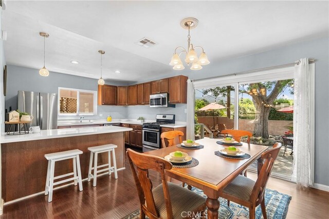 25159 Wheeler Rd, Newhall, CA 91321 - dining room with dark wood-type flooring, a chandelier, and recessed lighting
