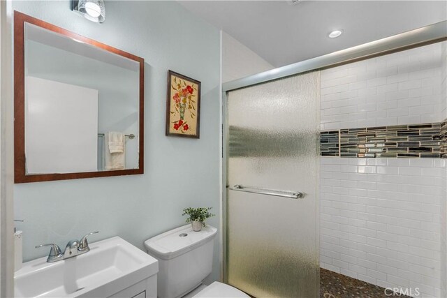 25159 Wheeler Rd, Newhall, CA 91321 - bathroom featuring tiled shower, toilet, vanity, and recessed lighting