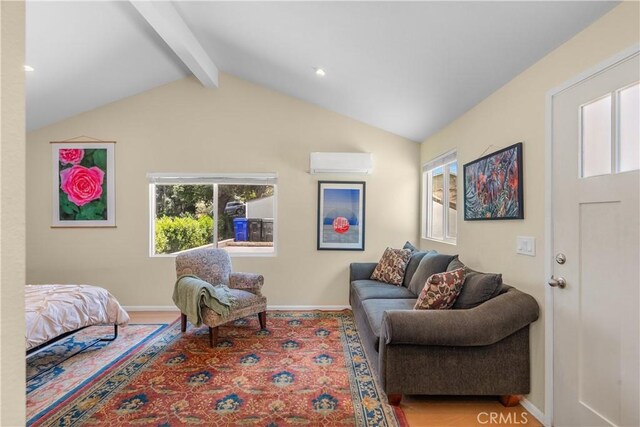 25159 Wheeler Rd, Newhall, CA 91321 - living area with a wall mounted air conditioner, healthy amount of natural light, and baseboards