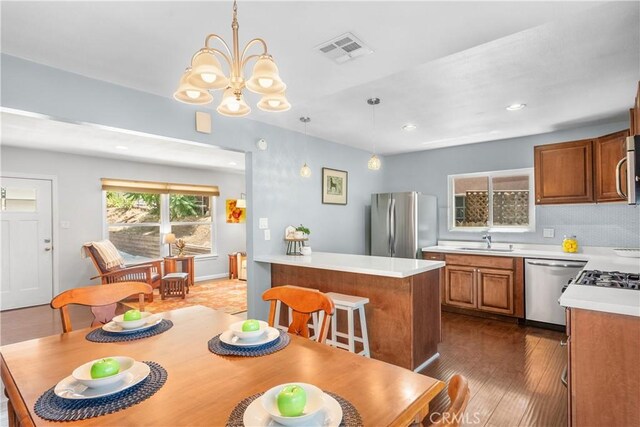 25159 Wheeler Rd, Newhall, CA 91321 - dining space featuring a chandelier, recessed lighting, and dark wood-style flooring