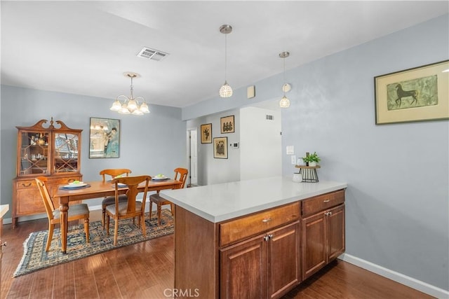 25159 Wheeler Rd, Newhall, CA 91321 - kitchen featuring light countertops, dark wood-type flooring, pendant lighting, and baseboards