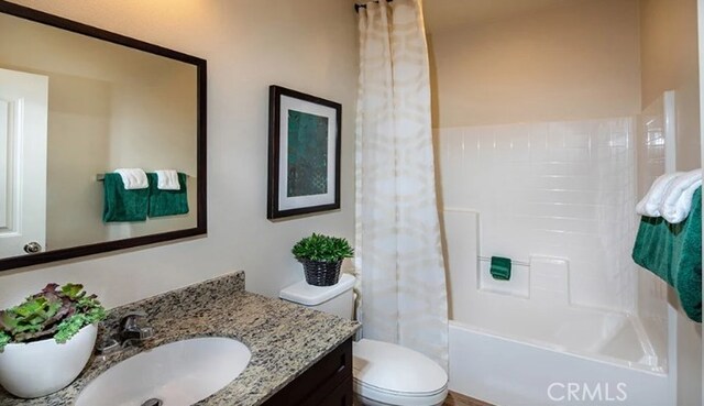 36895 Cascina Ln, Beaumont, CA 92223 - bathroom featuring vanity, toilet, and shower / bath combination with curtain