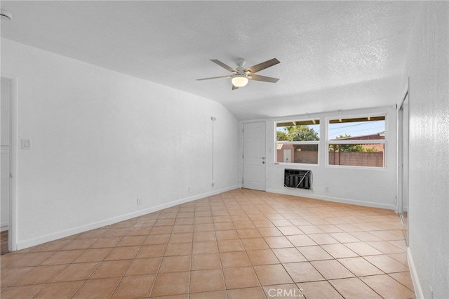 11422 Charlesworth Rd, Santa Fe Springs, CA 90670 - empty room featuring a ceiling fan, heating unit, lofted ceiling, baseboards, and light tile patterned floors