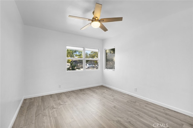 11422 Charlesworth Rd, Santa Fe Springs, CA 90670 - spare room featuring wood finished floors, a ceiling fan, and baseboards