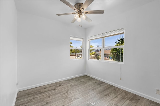 11422 Charlesworth Rd, Santa Fe Springs, CA 90670 - spare room with baseboards, light wood-type flooring, and ceiling fan