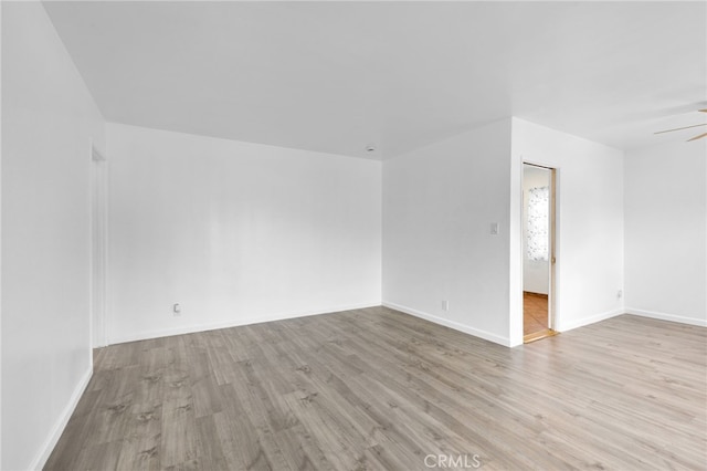 11422 Charlesworth Rd, Santa Fe Springs, CA 90670 - empty room with wood finished floors, baseboards, and ceiling fan