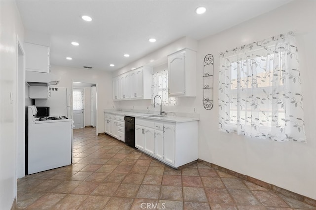 11422 Charlesworth Rd, Santa Fe Springs, CA 90670 - kitchen with white range, black dishwasher, a sink, white cabinetry, and light countertops