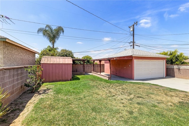 11422 Charlesworth Rd, Santa Fe Springs, CA 90670 - view of yard featuring a detached garage and driveway