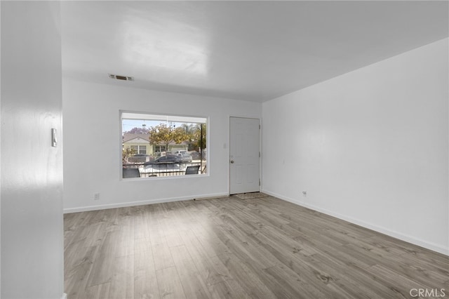 11422 Charlesworth Rd, Santa Fe Springs, CA 90670 - unfurnished room featuring wood finished floors and baseboards