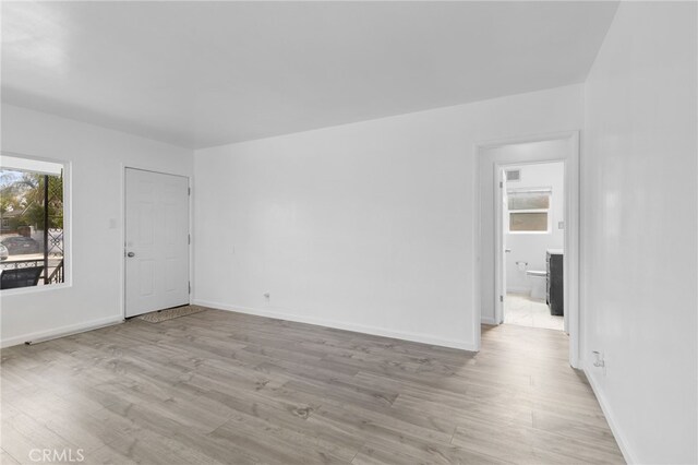 11422 Charlesworth Rd, Santa Fe Springs, CA 90670 - unfurnished room with light wood-type flooring and baseboards
