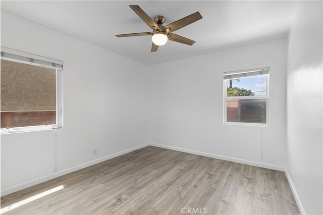 11422 Charlesworth Rd, Santa Fe Springs, CA 90670 - spare room with light wood finished floors, ceiling fan, and baseboards