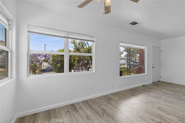 11422 Charlesworth Rd, Santa Fe Springs, CA 90670 - spare room with ceiling fan, wood finished floors, and baseboards