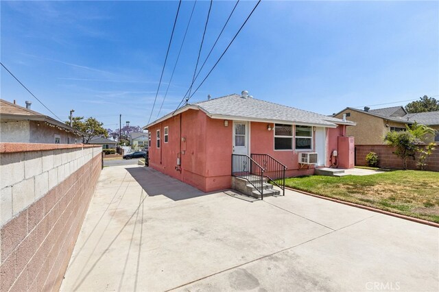 11422 Charlesworth Rd, Santa Fe Springs, CA 90670 - back of property with cooling unit, stucco siding, and roof with shingles