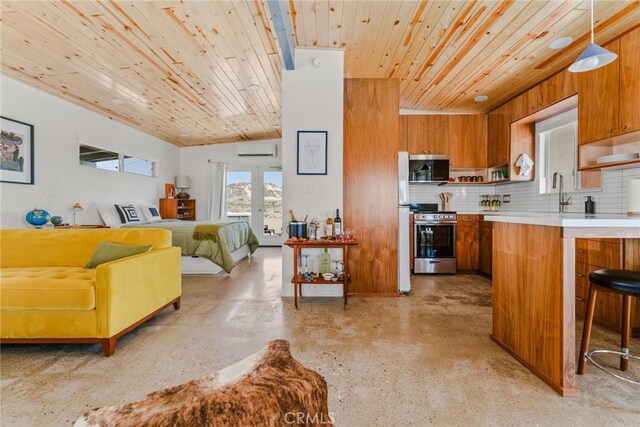 79124 Valle Vista Rd Unit 29, Palms, CA 92277 - kitchen with brown cabinetry, stainless steel appliances, light countertops, wooden ceiling, and a wall unit AC