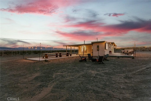 79124 Valle Vista Rd Unit 29, Palms, CA 92277 - playground at dusk featuring a wooden deck