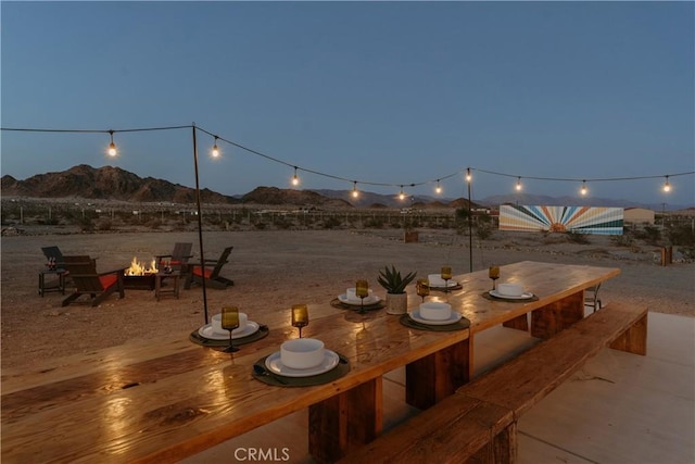 79124 Valle Vista Rd Unit 29, Palms, CA 92277 - view of patio with an outdoor fire pit and a mountain view